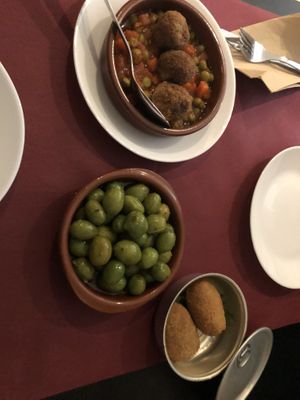 Meatballs, olives, croquettes   at La Perra Verde in Barcelona