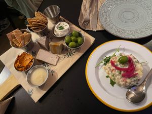 Cheese board and Russian salad  at La Perra Verde in Barcelona