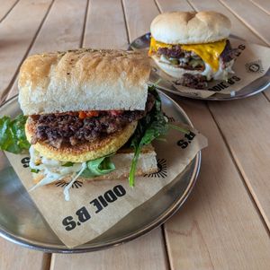 Vegan Boujee with Impossible Sausage (front), Double OD Burger with green chiles (back) at Odie B's in Denver