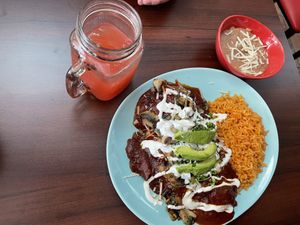 Chilaquiles (chose mushroom filling)with a side of pinto beans and watermelon arguas frescas.  Excellent and very filling😋  at El Cantaro Vegan Taqueria in Sacramento