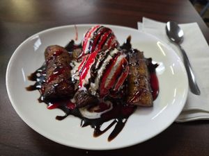 Fried plantains with vanilla soy ice cream with chocalate and strawberry sauce at El Cantaro Vegan Taqueria in Sacramento