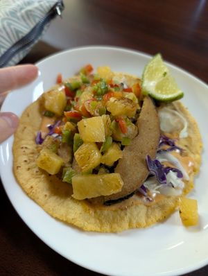 Baja style fish taco with pineapple salsa, delicious! at El Cantaro Vegan Taqueria in Sacramento