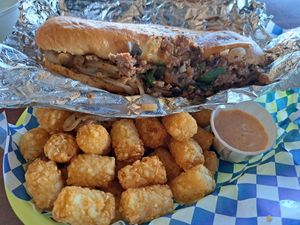Philly Cheesesteak and Tater tots with Chipotle dipping sauce.  at Happy Vegan in Fountain Valley