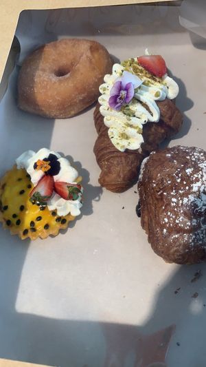 Cinnamon donut, rhubarb custard croissant, passion fruit tart and a pain au chocolat   at Miss Sina in Marrickville