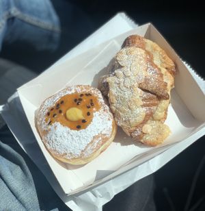 Passion fruit custard filled donut and almond croissant 🥐.   at Miss Sina in Marrickville