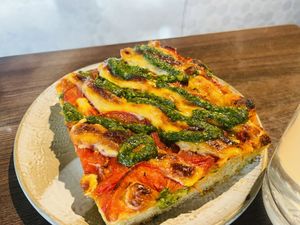 Pizza slice with pesto  at Miss Sina in Marrickville