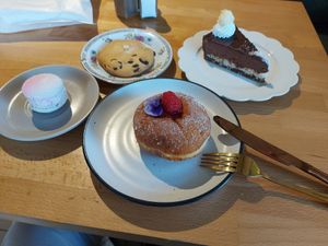 Raspberry filled donut, Bounty cake, raspberry macaroni and a simple chocolate chip cookie 😊 at Miss Sina in Marrickville