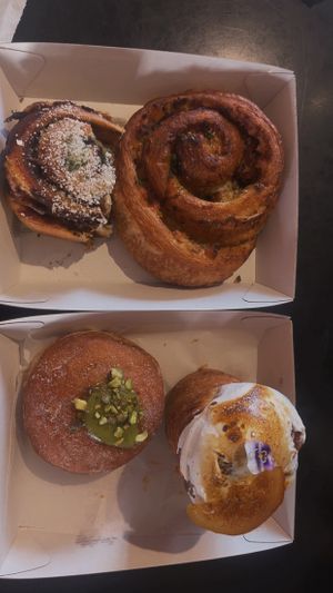 Vegemite scroll, cheese n bakin scroll and pistachio donut and lemon meringue   at Miss Sina in Marrickville