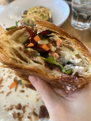 Banh Mi Croissant- incredible filling of vegan duck, pâté, coriander, chilli, pickled carrot, and pickled daikon  at Miss Sina in Marrickville