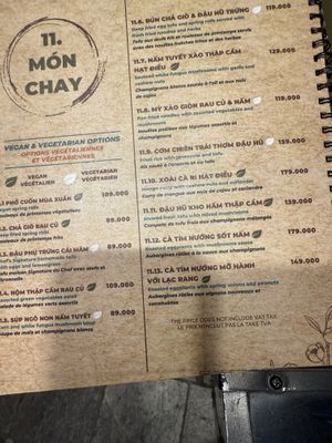 The menu is multiple pages of meat dishes with one page of vegetarian options    at Cai Mam Bistro - Signature Vegan in Hanoi