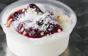 Malabi dessert - Middle Eastern panna cotta with berry glaze, coconut and peanut flakes at Beyond Falafel in Quarteira