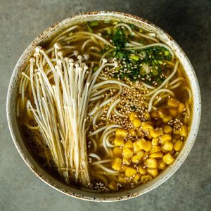 Miso based broth with enoki mushrooms, sweet corn and spring onions at Yasai Ramen in Lisbon