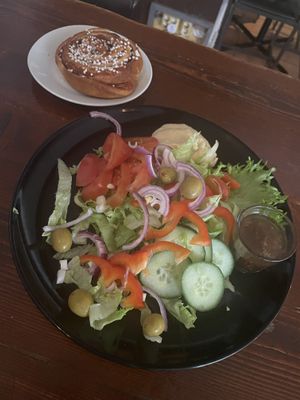 Cinnamon bun and custom vegan salad  at Café And The Bakery in Gothenburg