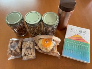 cookies, muffin, coffee, nuts, dried fruits, and a book at Yupanqui - ゆぱんき in Hirosaki