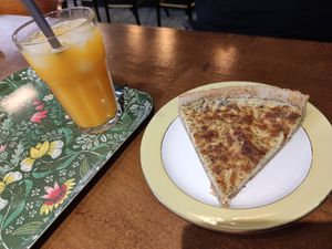 Quiche and orange juice at L'arche À L'eau in Reims