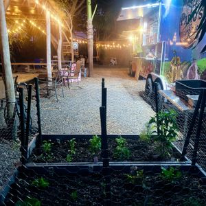 View of the private courtyard at Stable Road Farm from Papio's Place herb garden. at Papio's Place - Kiosk in Kihei