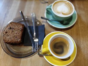 Cafe doppio, pan de plátano y capuccino con leche de avena at ATYPICA Coffee in Granada