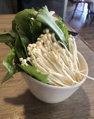 Enoki and greens  at Seven Hotpot Restaurant in Abu Dhabi