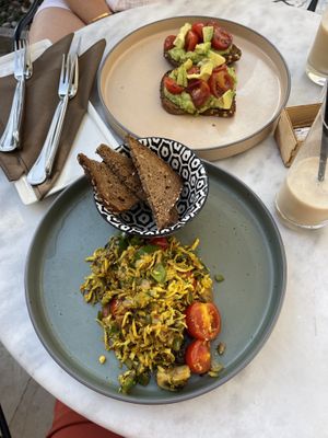 Tofu scramble, avocado toast with roasted tomatoes and almond milk iced coffee  at Café Strauss in Opatija