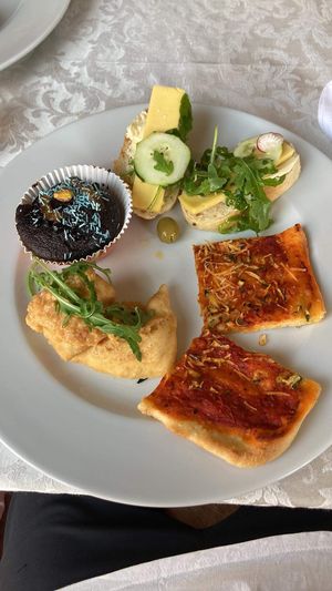 Selection from all you can eat vegan table - scrambled tofu, bread with vegan cheese, muffin, pizza  at PiranArt Restaurant & Gelateria & Caffeteria in Piran