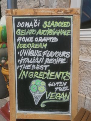 Sign outside at PiranArt Restaurant & Gelateria & Caffeteria in Piran