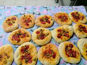 Vegan home made bread with olives, tomato and localy produced olive oil. Like small pizza. at PiranArt Restaurant & Gelateria & Caffeteria in Piran