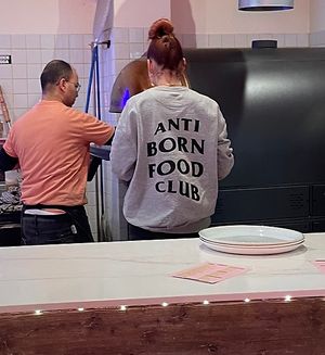 Anti born food club sweater   at RAZZO Vegan Pizza Bar in Cologne