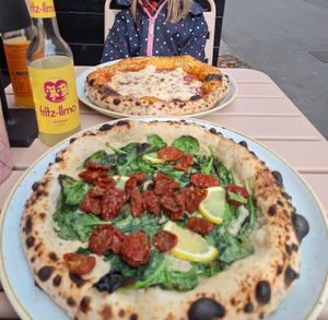 Pizza "Spinach and lemon" and an individual Marinara with Cashew Mozzarella and Parmesan at RAZZO Vegan Pizza Bar in Cologne