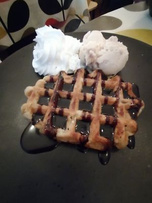 Waffle with chocolate sauce and biscoff ice-cream at Hooper's in Swansea