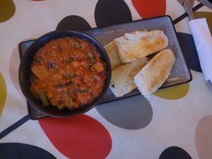 Plant Chicken Curry Bowl with Warm Mezzaluna Bread at Hooper's in Swansea