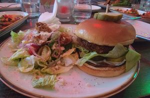 Tofu burger with Indian spices and side salad. at Good Intentions in St Petersburg