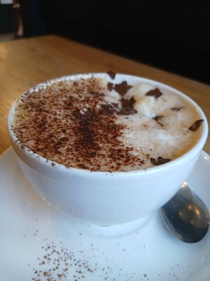 Best coffee ever with delicious dark chocolate sprinkles!! at Zappa's in Totnes