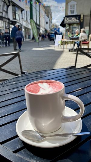 Beetroot latte 🩷💜 in the sunshine, fabulous place to people watch    at Zappa's in Totnes