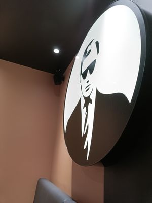 Logo in back of restaurant at VINCENT - The Playce in Berlin