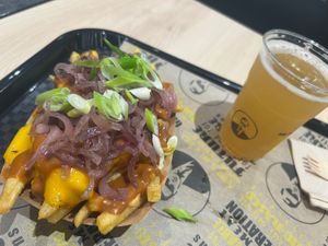 Animal style fries and appel schorle  at VINCENT - The Playce in Berlin