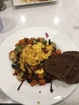 Vegan sweet potato Brussel sprout hash with vegan egg  at Anna's House - Grand Haven in Grand Haven