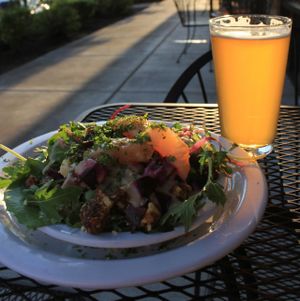 A delicious salad and brew on the sunny patio! at Broken Top Bottle Shop and Ale Cafe in Bend