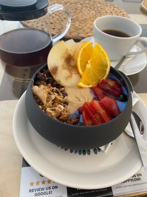 Granola bowl with filter coffee at Mishto Café & Deli in Budapest