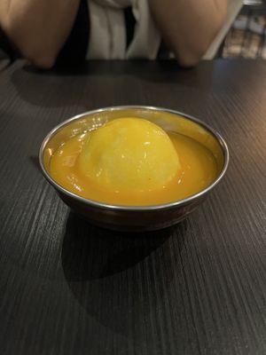 Vegan coconut ice cream with mango coulis   at Hindusthali in Toronto