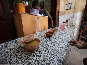 There is a table outside at Bissara Shop in Fes