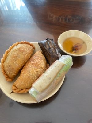 Appetisers: 2 vegan samosas, shredded tofu roll and rice dumpling cake - 35k at Mỹ Thoa Chay in Da Lat