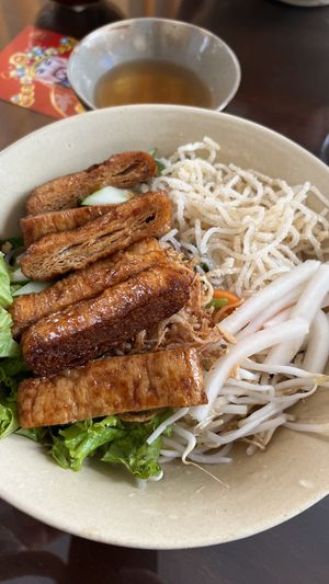 Grilled vegan meat with noodles and raw veg (my favorite, so flavorful and fresh)  at Mỹ Thoa Chay in Da Lat