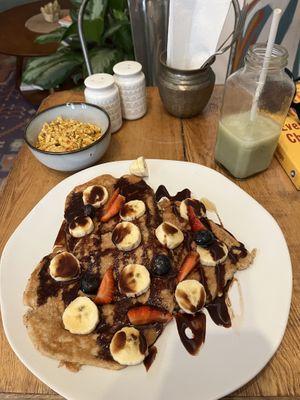 Pancakes, side of tofu scramble, half drank matcha   at The Vegan Shack in Panama City