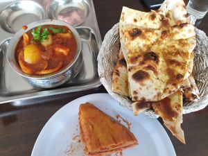 Soy chaap masala, garlic naan, bread pakora at Om Vegetarian Tarneit in Tarneit