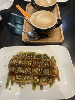 Pistachio waffle and decaf cappuccino 🥳  at Chocolate Bar Brugge in Bruges