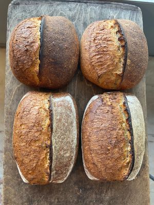 Our Classic Sourdough Wheat bread (here in different shapes) goes by the name of Trigo Tradicional com Barbela. It contains Portuguese Heritage Wheat.  at Massa Mãe in Lisbon