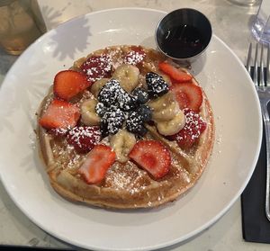 Yummy Belgian Waffle with fresh fruit and maple syrup.  at Urban Vegan Kitchen in New York City
