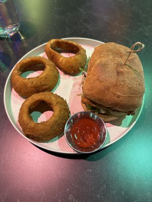 Tofuego with side of onion rings  at Urban Vegan Kitchen in New York City