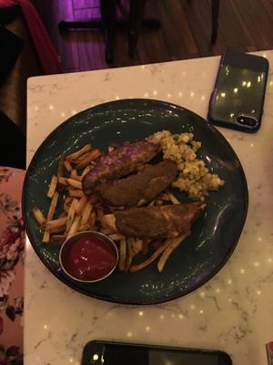 Jerks chicken with fries. at Urban Vegan Kitchen in New York City