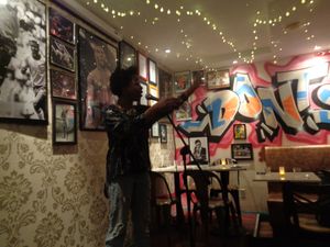 Host of the Monday night comedy working the crowd. at Urban Vegan Kitchen in New York City